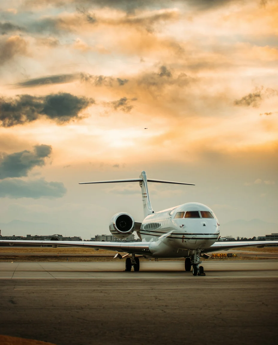 Private jet on the apron at sunset